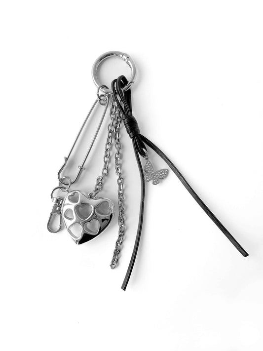 Multi-layer keychain with pin, heart, chain and leather rope combination, unique accessory.