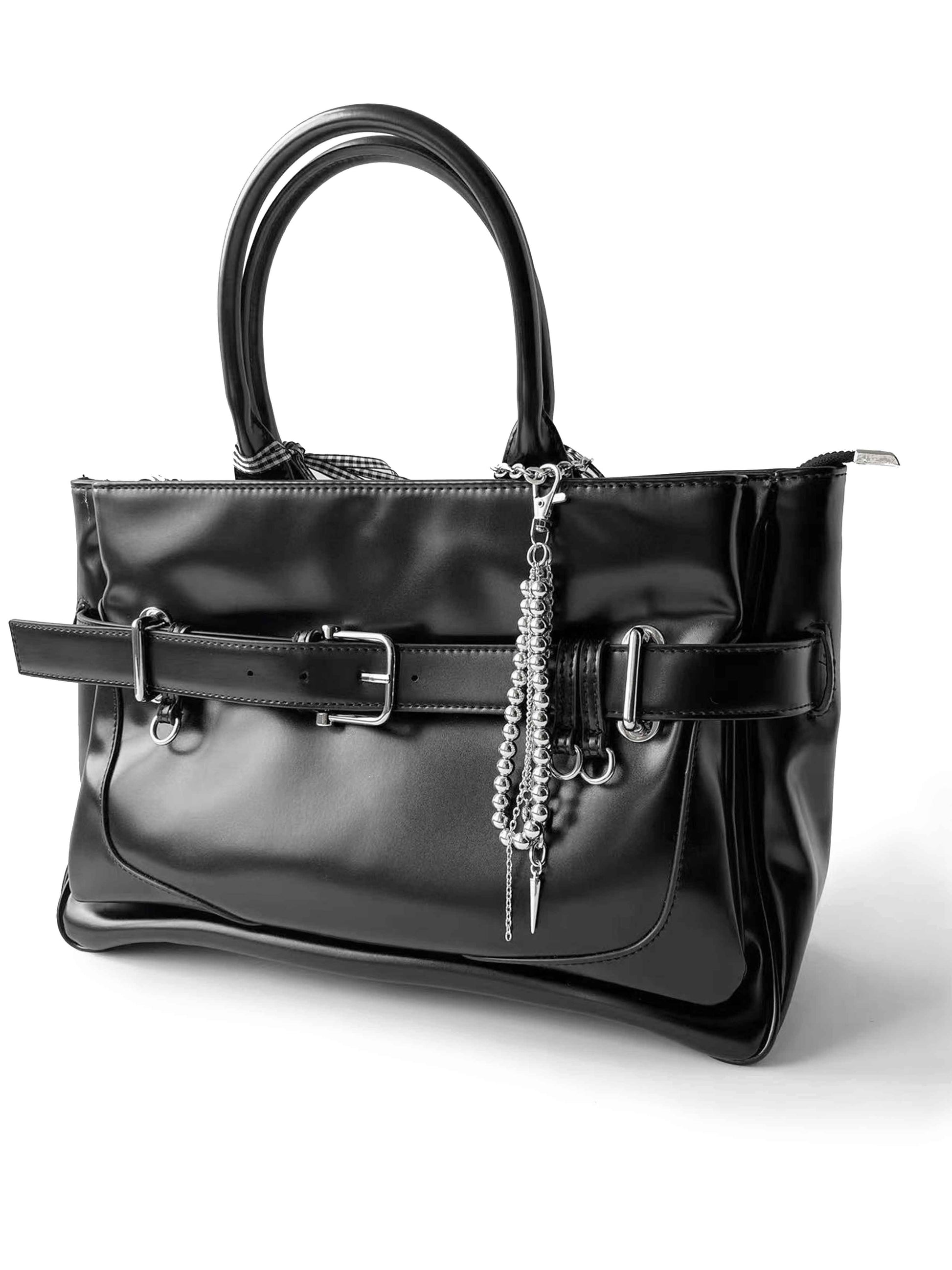 Black glossy leather handbag with multi-layer bead chain accessory and plaid scarf, fashionable and unique.
